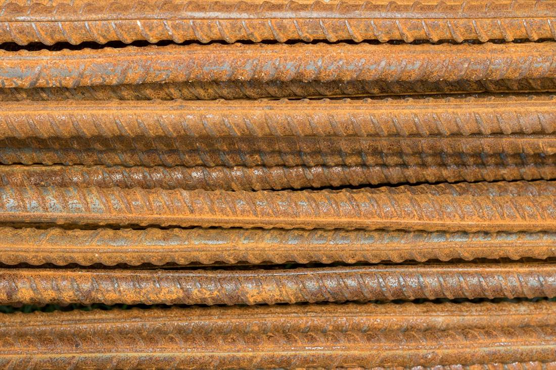 Deformed reinforcing bar bundled and stacked ready for cartage.