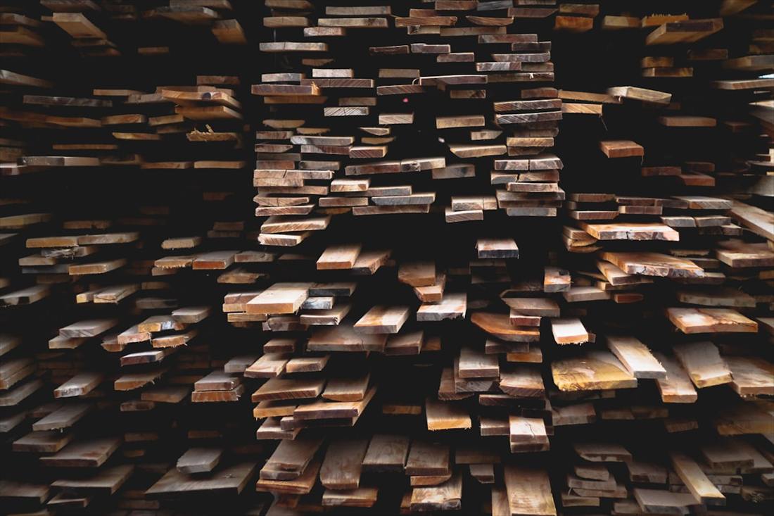 Sawn structural timber stacked in graded lengths ready for loading.